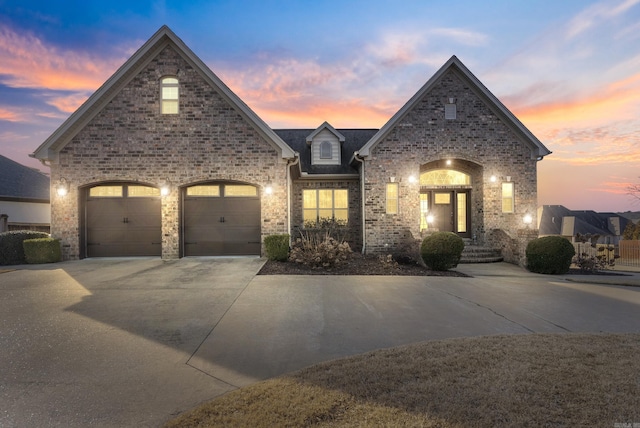 french country style house with a garage