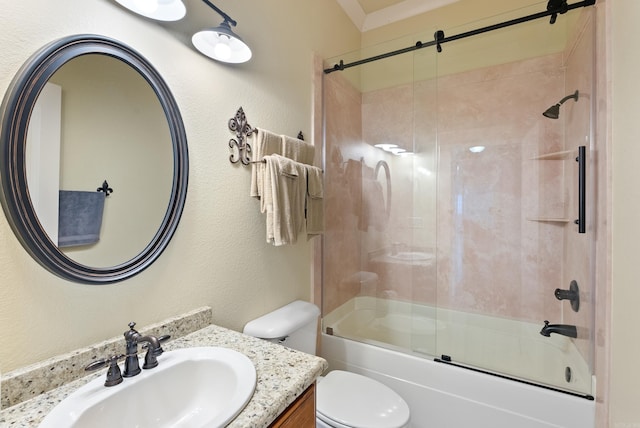 full bathroom featuring enclosed tub / shower combo, vanity, and toilet