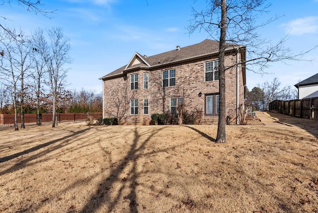 back of house with a yard