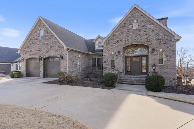 french country style house with a garage