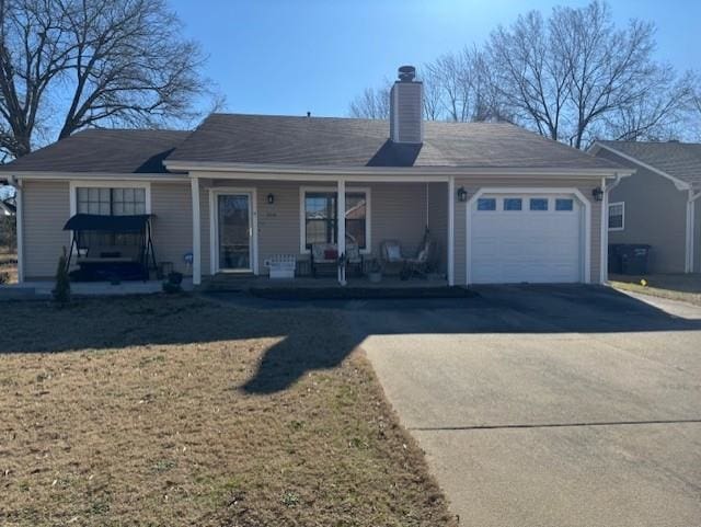 view of front of property featuring a garage and covered porch