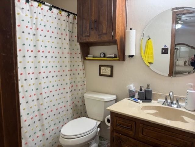 bathroom with vanity, toilet, and walk in shower