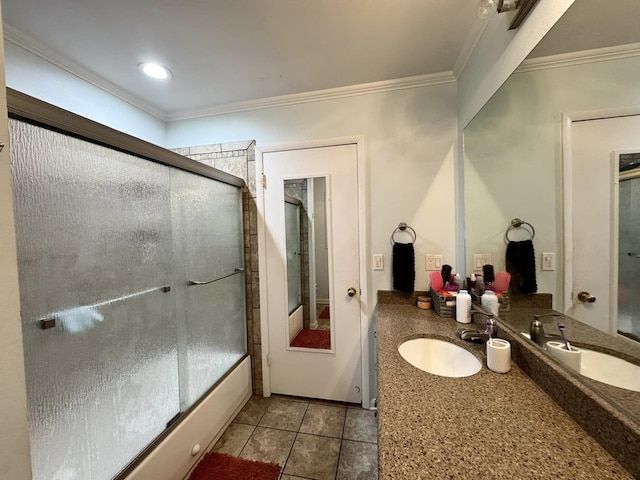 bathroom featuring vanity, crown molding, tile patterned floors, and shower / bath combination with glass door