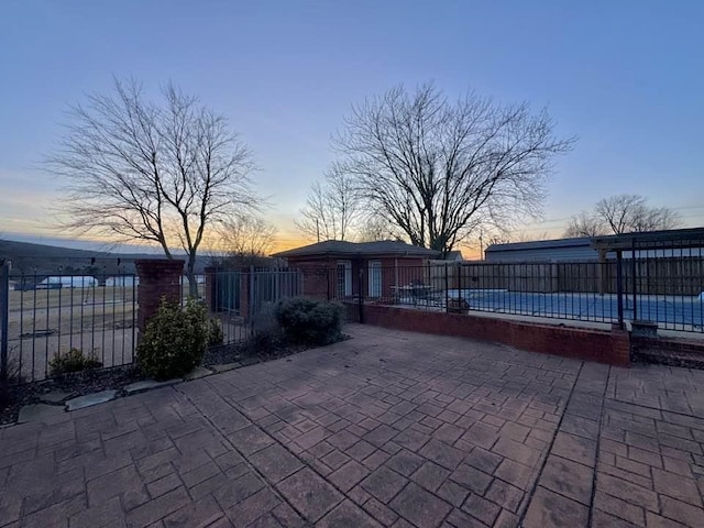 view of patio terrace at dusk