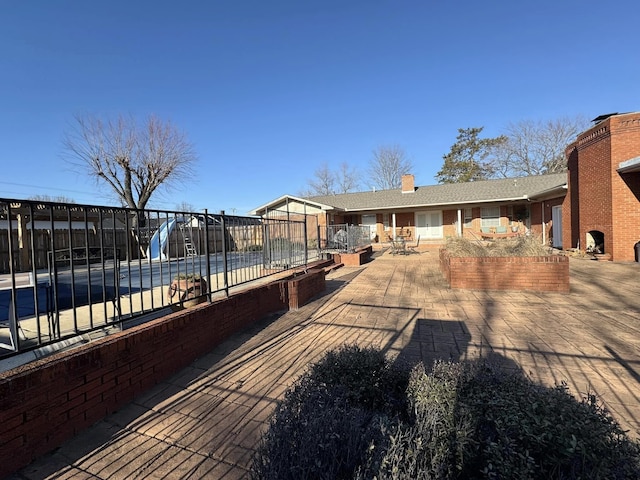 exterior space featuring a swimming pool and a patio area