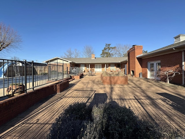 back of house featuring a patio and french doors