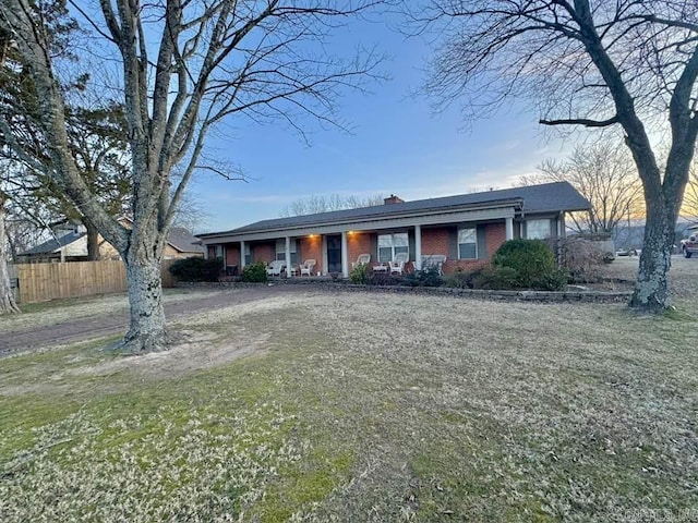 ranch-style house with a front lawn