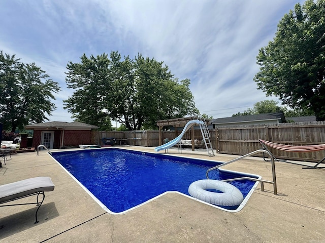 211 Service St, Mountain View, AR 72560 - view of swimming pool with a fenced backyard, a water slide, a patio, and an outbuilding