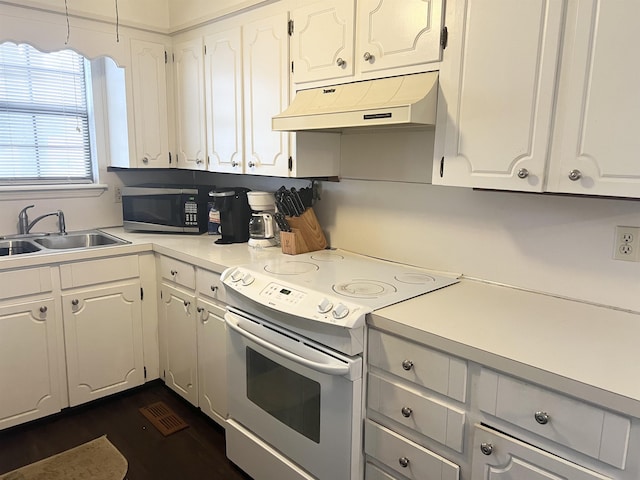 kitchen featuring white cabinetry, white electric range, and sink