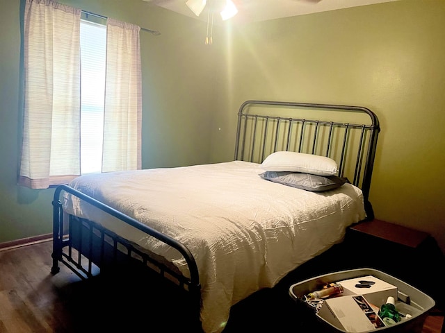 bedroom featuring dark wood-type flooring and ceiling fan