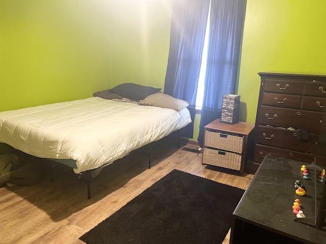 bedroom featuring light wood-type flooring