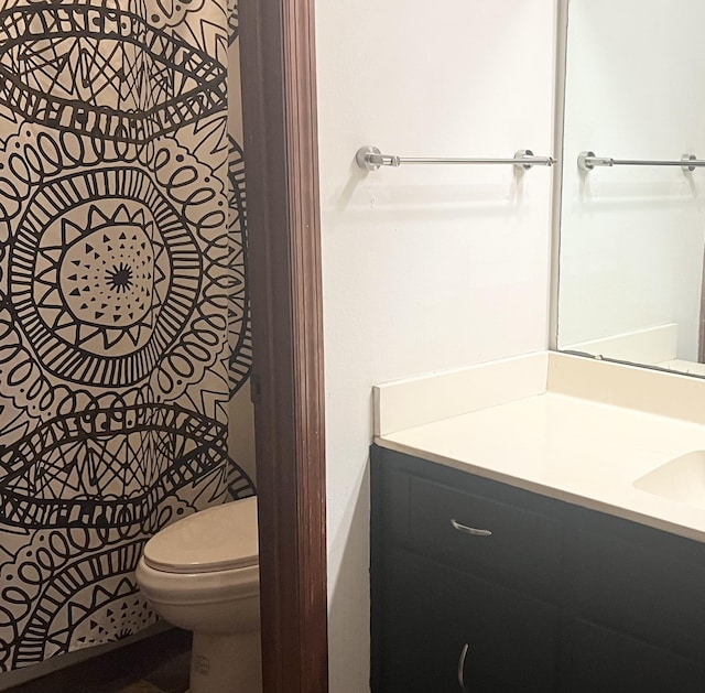 bathroom with vanity and toilet