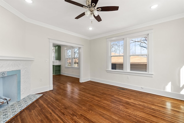 unfurnished living room with dark hardwood / wood-style flooring, ornamental molding, and ceiling fan