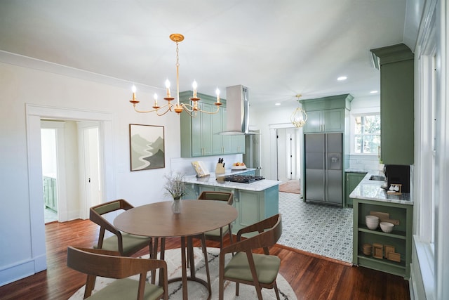 dining space featuring an inviting chandelier and dark hardwood / wood-style flooring