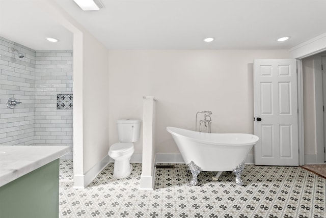 bathroom with vanity, a bathtub, and toilet