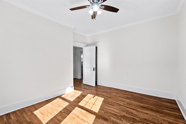 spare room featuring wood-type flooring, ornamental molding, and ceiling fan