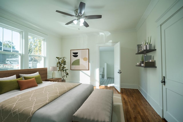 bedroom featuring dark wood-type flooring, ornamental molding, and ceiling fan