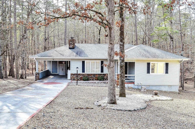 single story home featuring a carport