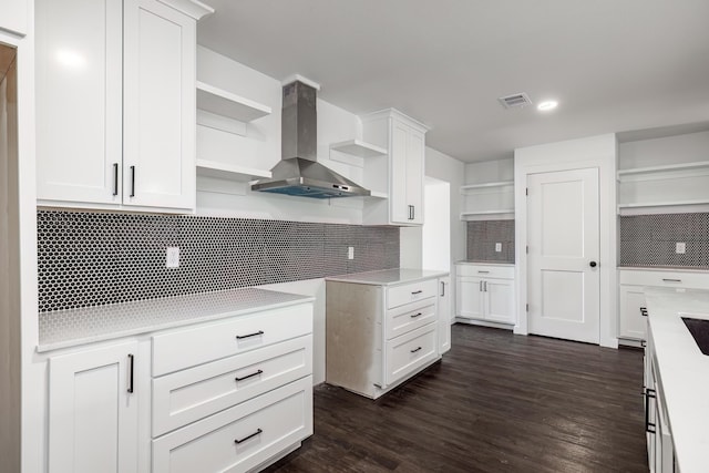 kitchen featuring dark hardwood / wood-style floors, range hood, and white cabinets