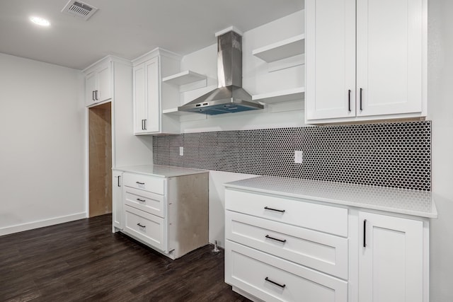 kitchen featuring white cabinetry, island exhaust hood, and dark hardwood / wood-style flooring