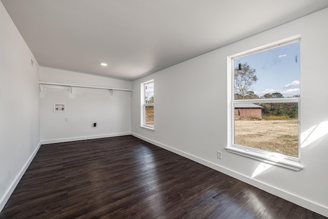 spare room featuring dark wood-type flooring