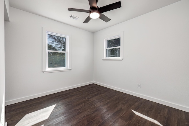 unfurnished room featuring ceiling fan and dark hardwood / wood-style flooring