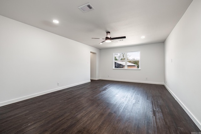 unfurnished room featuring dark hardwood / wood-style floors and ceiling fan