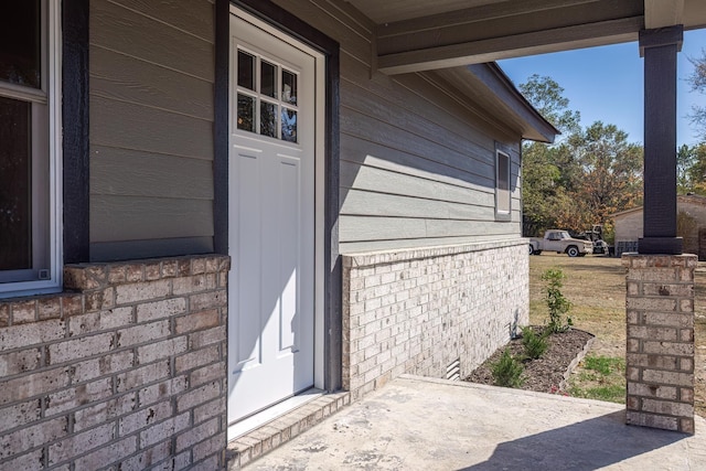 doorway to property featuring a patio area