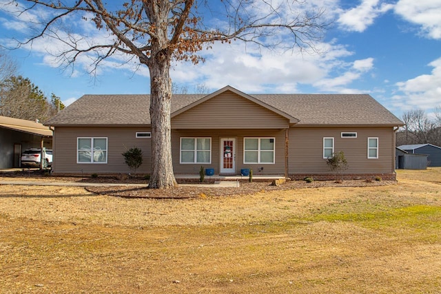 single story home featuring a front yard and a carport