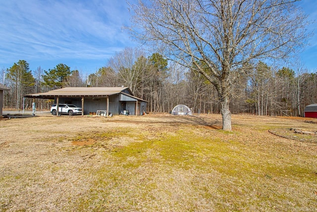 view of yard featuring a carport