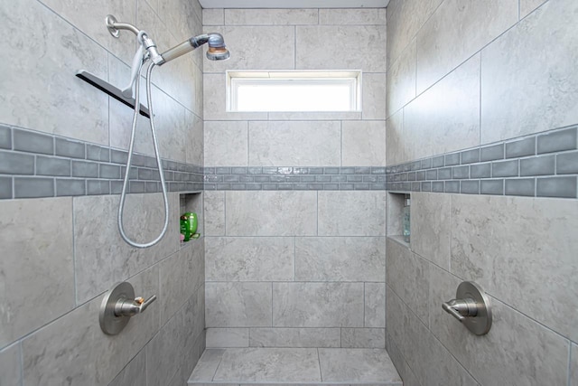 bathroom featuring tiled shower