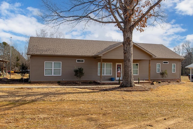 ranch-style home with a front lawn