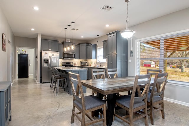 dining space with sink