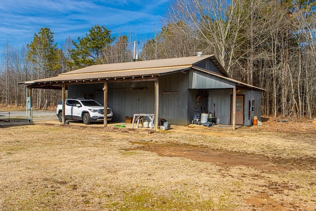 view of outbuilding with a carport