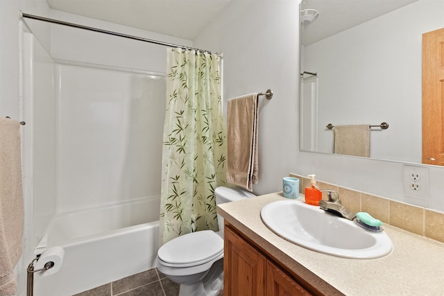 full bathroom with shower / tub combo with curtain, tile patterned floors, toilet, vanity, and decorative backsplash