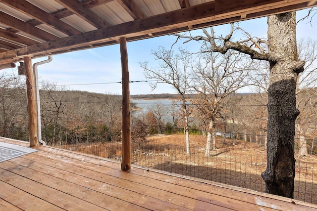 wooden deck featuring a water view