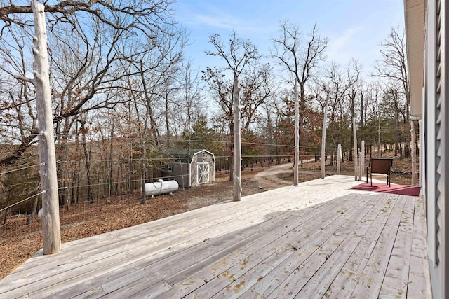 wooden deck featuring a shed