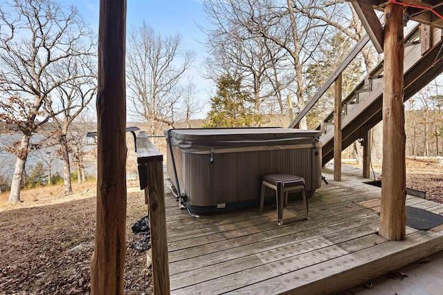 wooden terrace with a hot tub