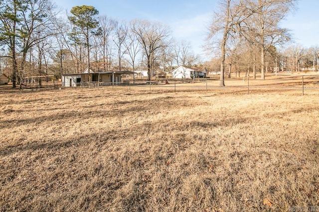 view of yard featuring an outbuilding and a rural view