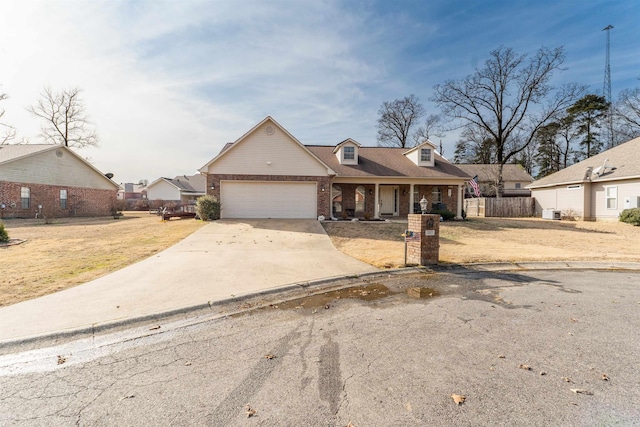 view of front of house featuring a garage and a front lawn