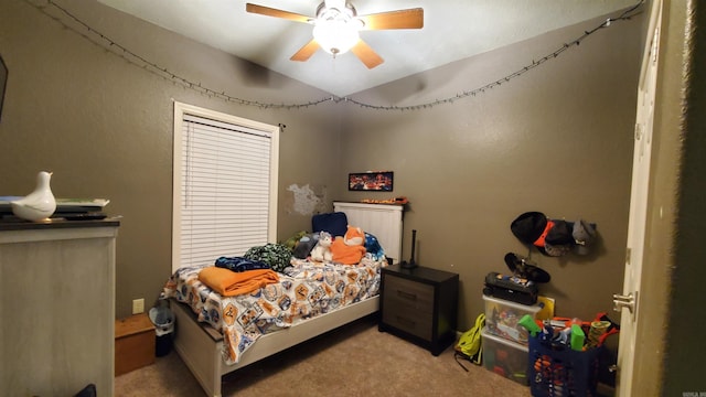 bedroom with light colored carpet and ceiling fan