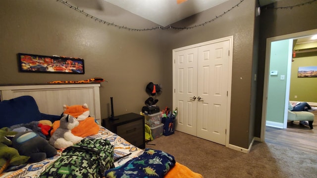 bedroom with a closet and carpet