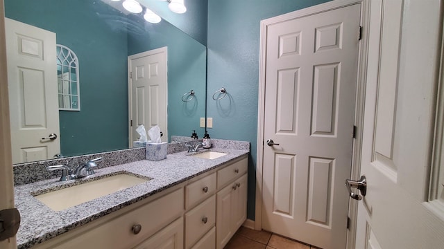 bathroom with tile patterned floors and vanity