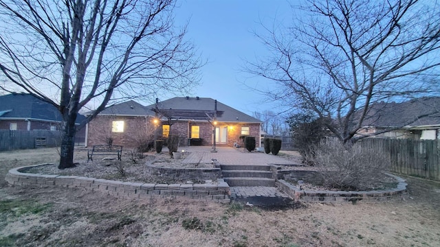 rear view of property featuring a patio area