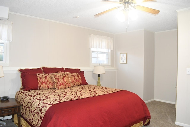 bedroom with crown molding, carpet floors, a textured ceiling, and ceiling fan