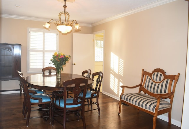 dining room with crown molding, a chandelier, and dark wood-type flooring