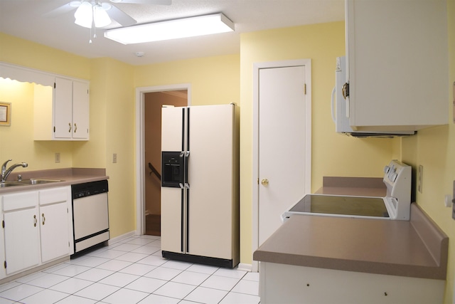 kitchen featuring sink, white cabinetry, light tile patterned floors, ceiling fan, and white appliances