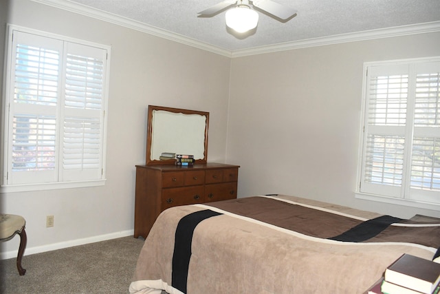 bedroom with ceiling fan, ornamental molding, carpet floors, and a textured ceiling