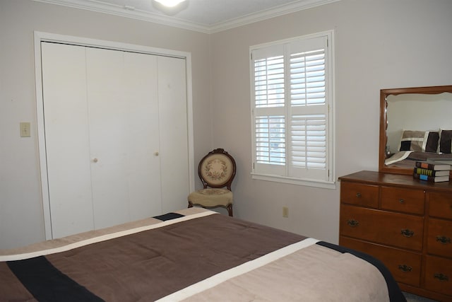 bedroom with ornamental molding and a closet