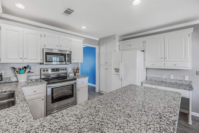 kitchen featuring white cabinetry, ornamental molding, stainless steel appliances, and dark hardwood / wood-style floors